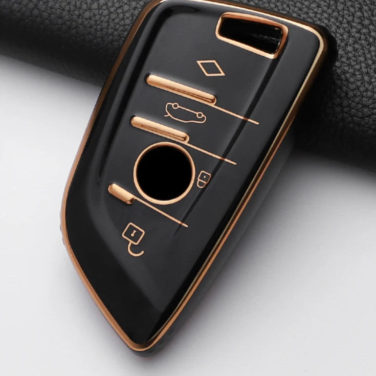 Black and rose gold car key fob cover on a white background