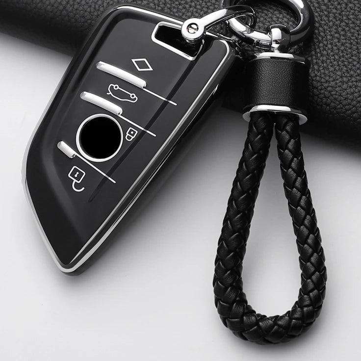 Car key fob cover with braided black keychain on a white background
